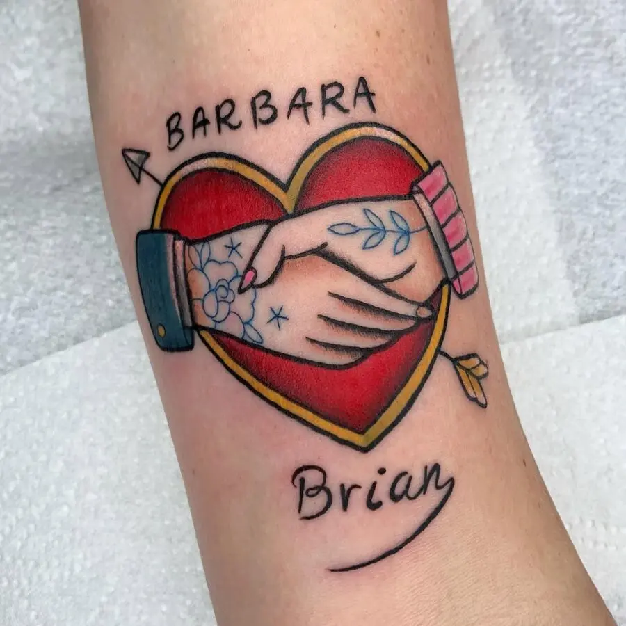 Colorful heart tattoo with joined hands