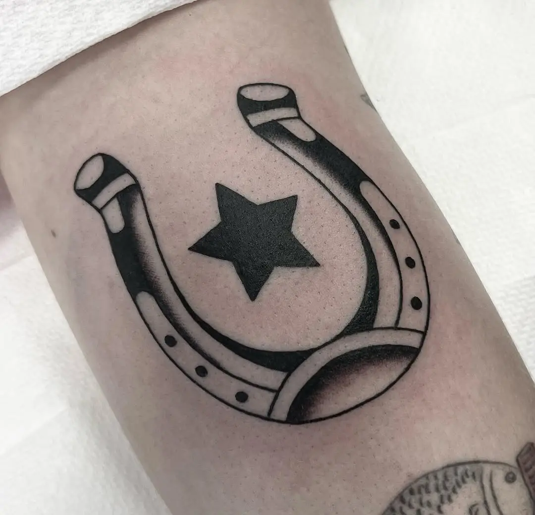 Unique horseshoe tattoo with star detail