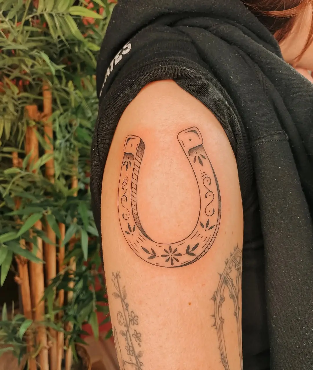 Charming horseshoe tattoo radiates good luck