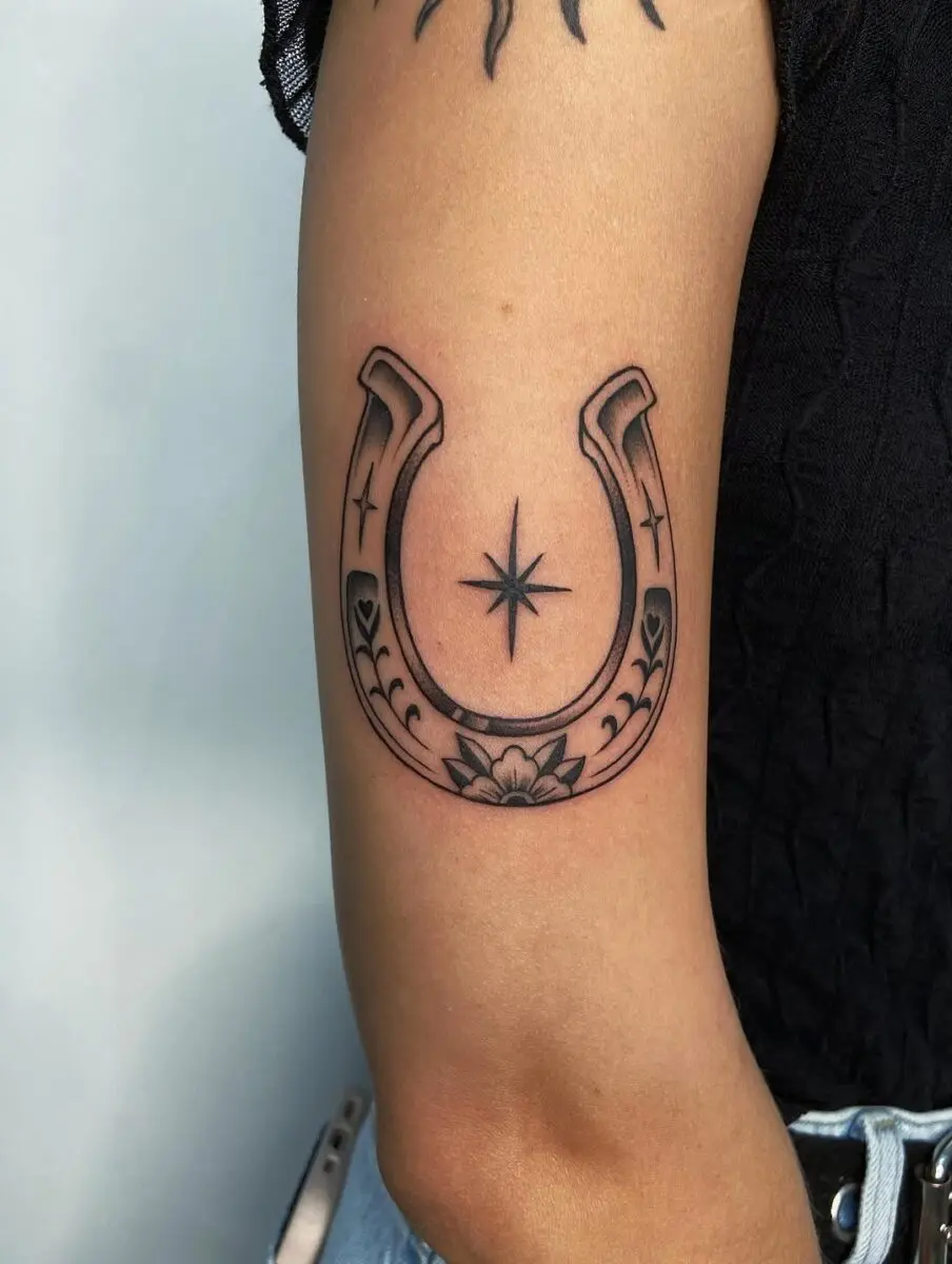 Stylish horseshoe tattoo with floral accents