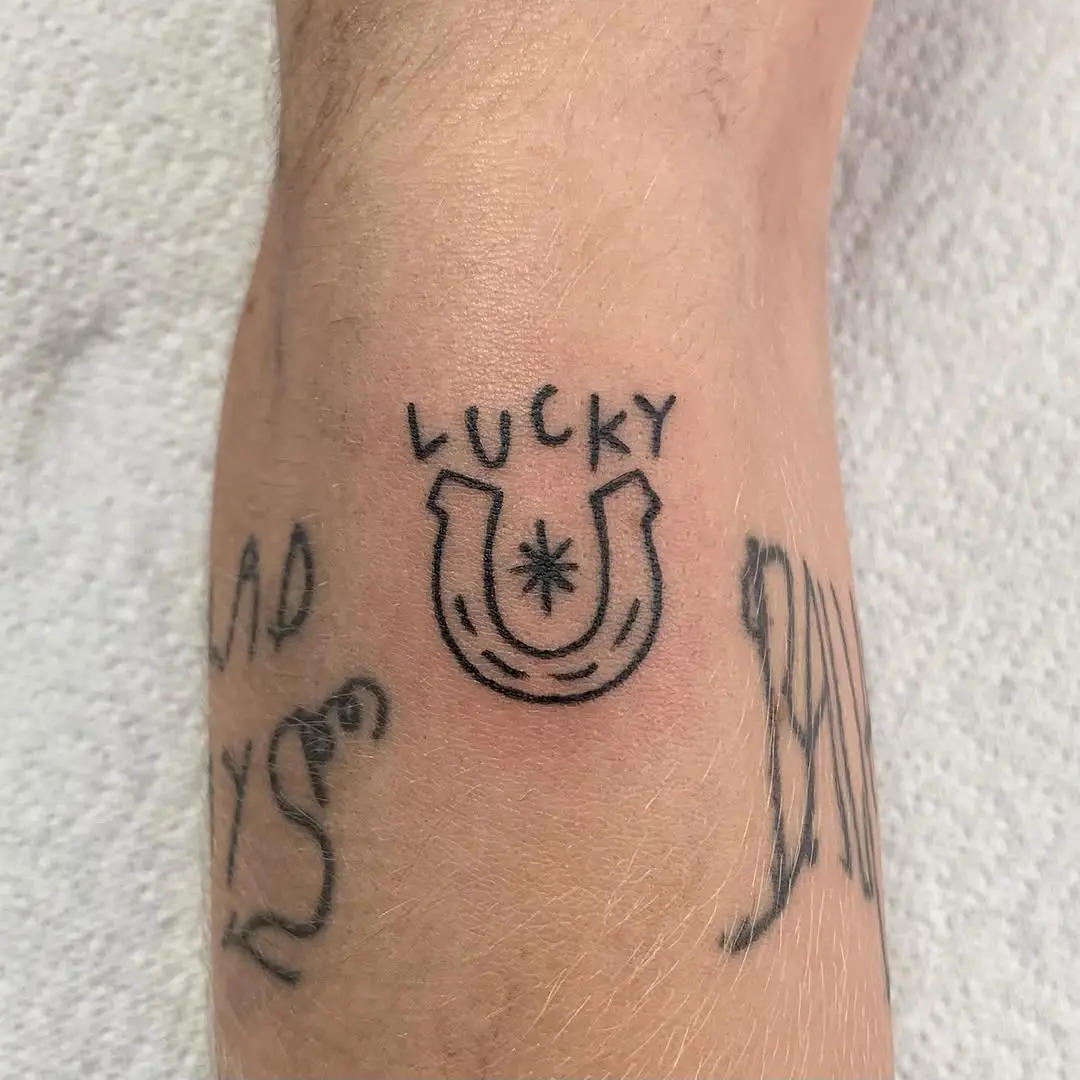 A unique lucky horseshoe tattoo design