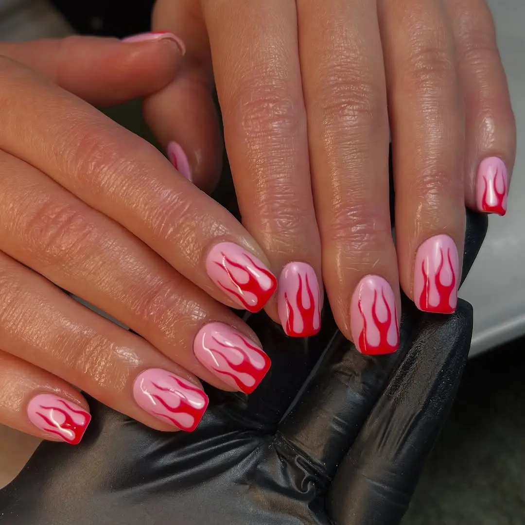Stylish flames on hot pink nails