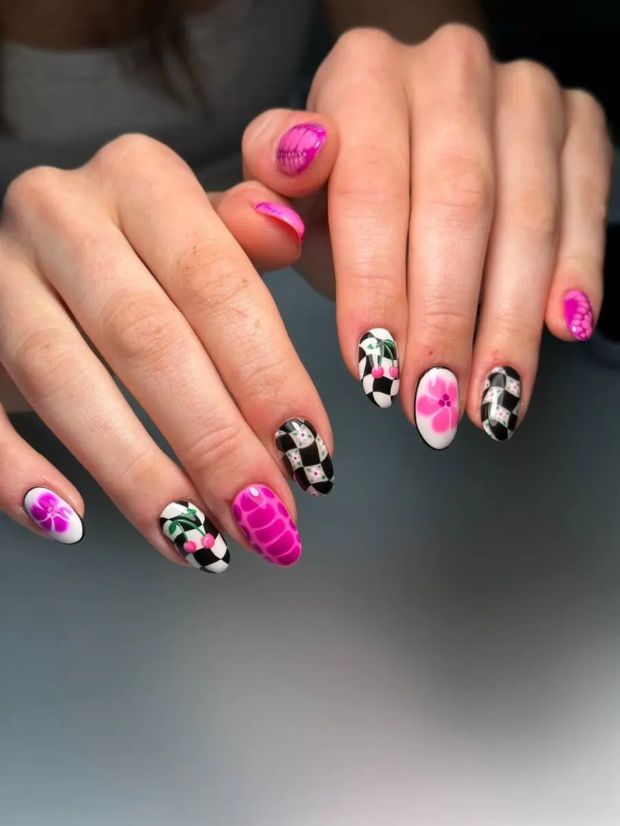 Vibrant hot pink nails with artistic designs