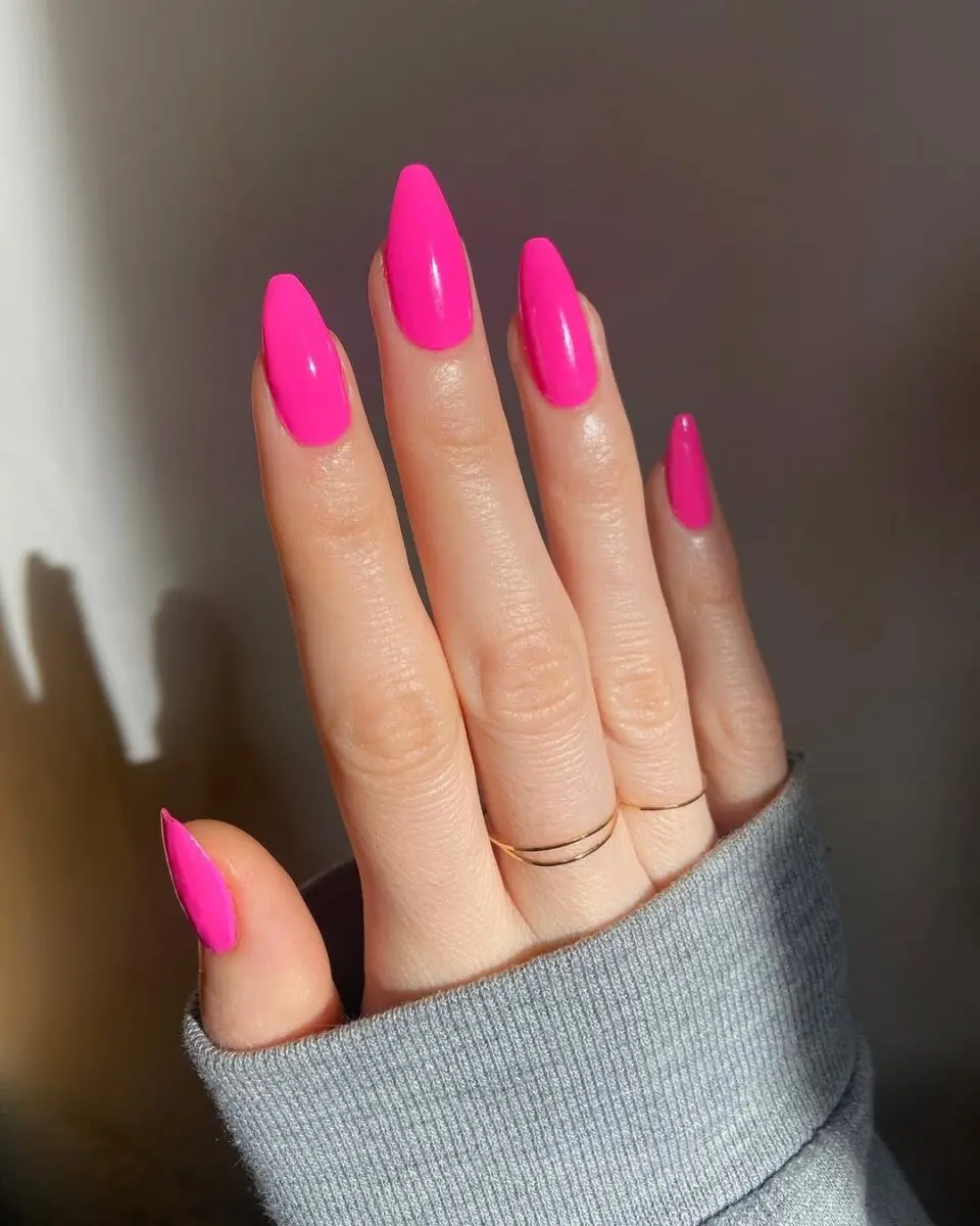 Stylish hot pink manicure for a bold look