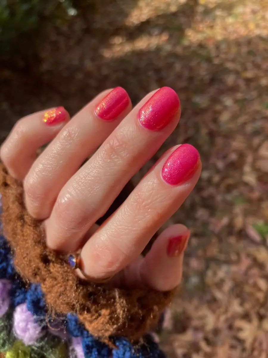 Radiant hot pink nails with sparkling accents