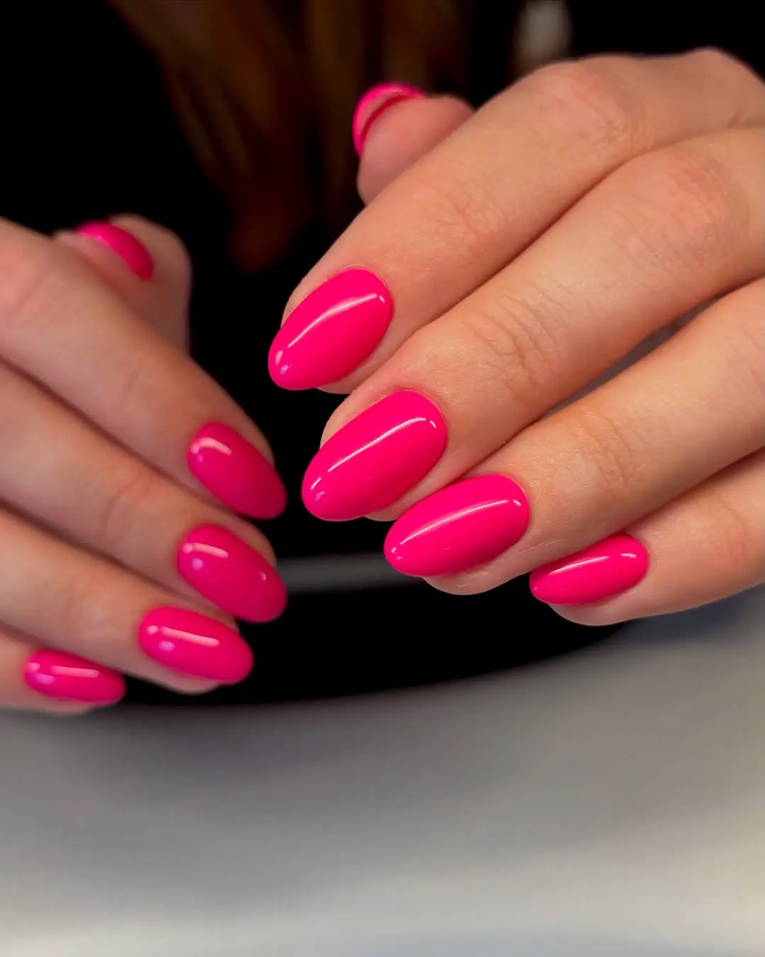 Vibrant hot pink nails for a bold look