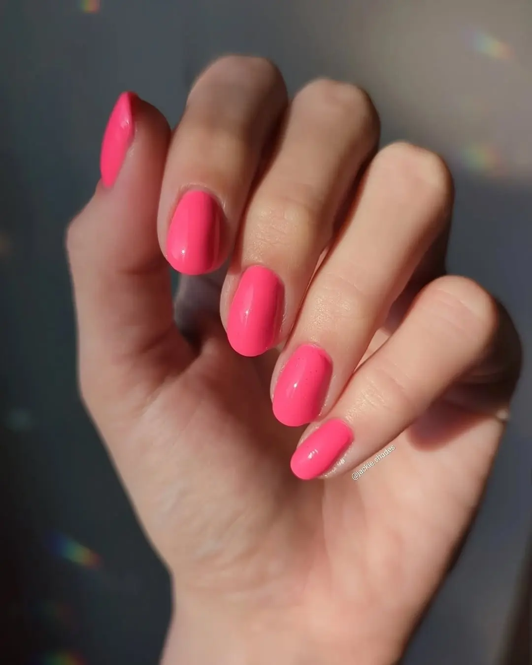 Vibrant hot pink nails for summer vibes