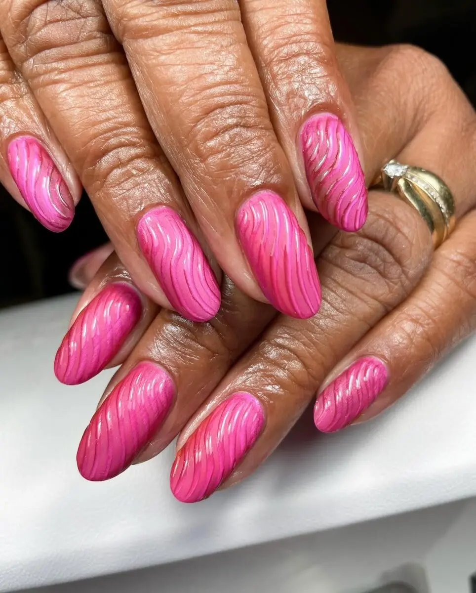 Stylish hot pink nails with wavy designs