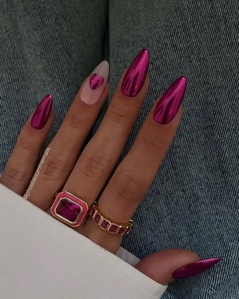 Stylish hot pink stiletto nails with heart design