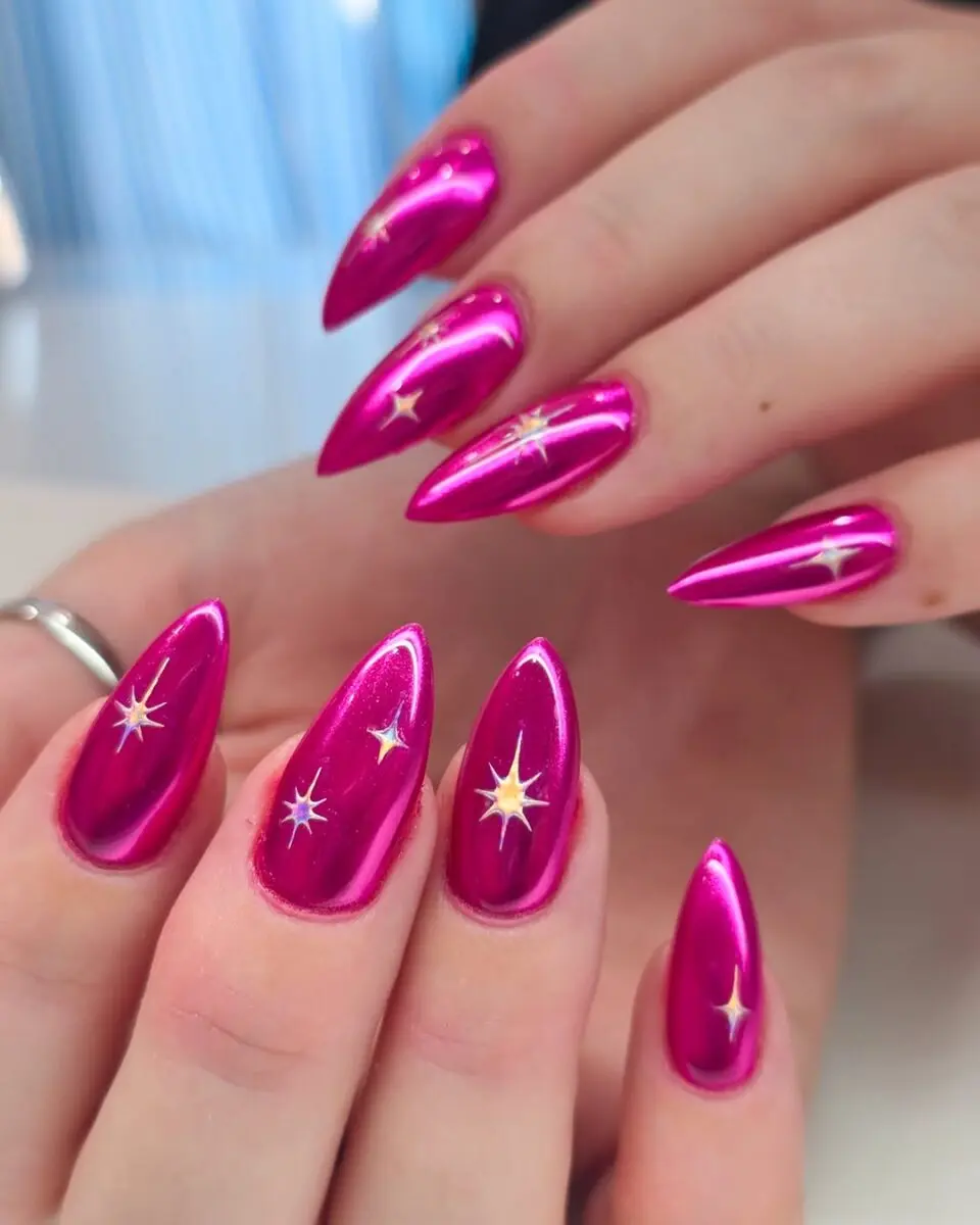 Vibrant hot pink stiletto nails with star accents
