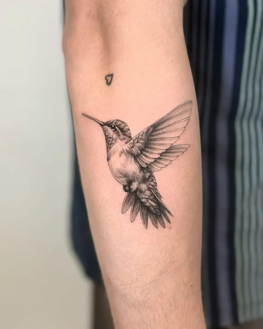 Elegant hummingbird tattoo symbolizing peace and freedom