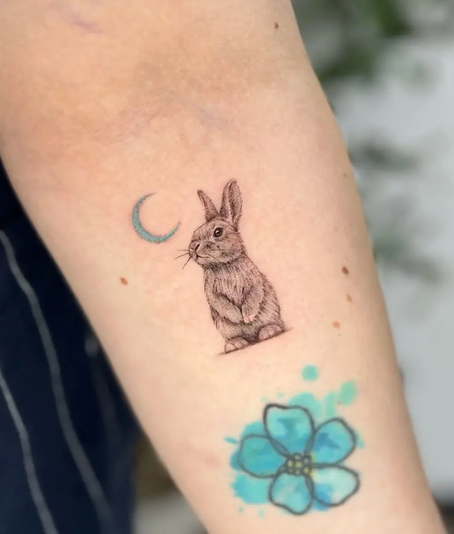 Charming rabbit tattoo with moon and flower