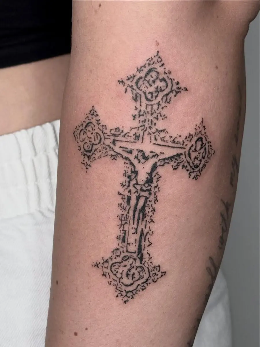 Elegant Jesus cross tattoo design on arm