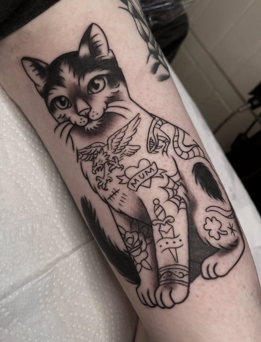 Whimsical cat tattoo exuding playful charm