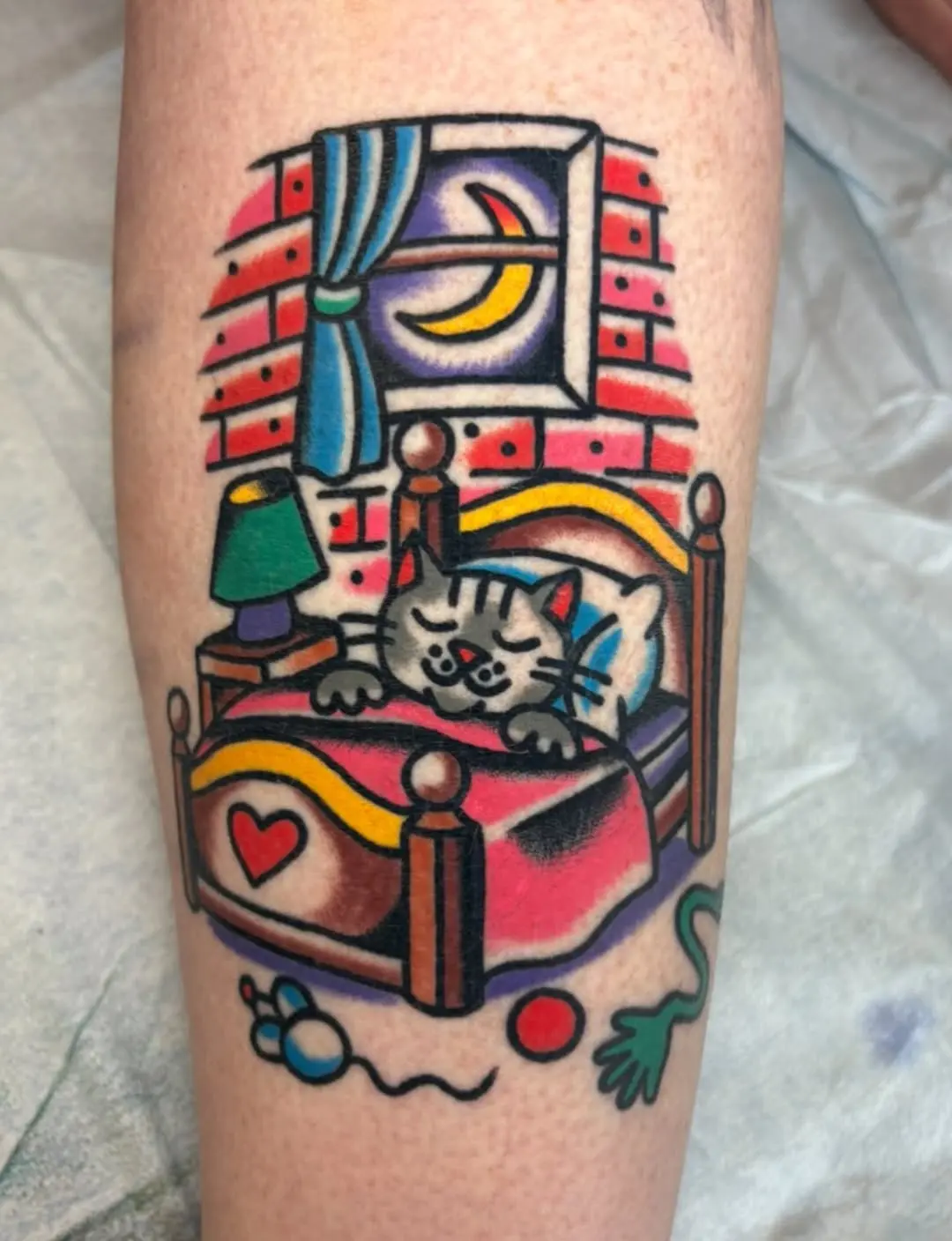 Adorable sleeping cat in a whimsical bedroom