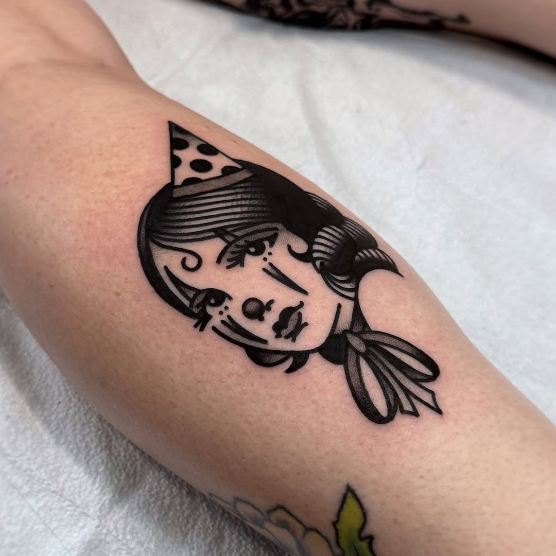 Unique clown girl tattoo with playful vibe