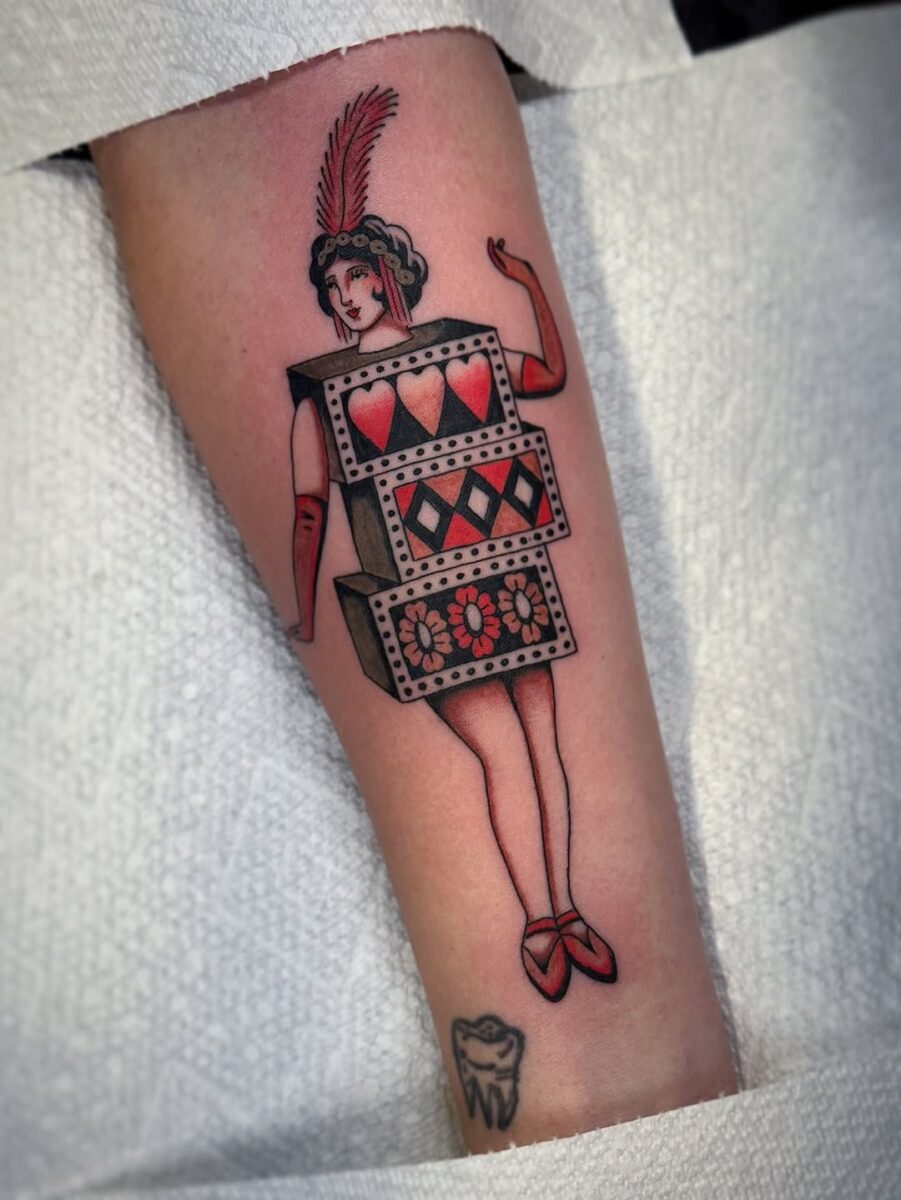 Vintage showgirl tattoo with playful elements