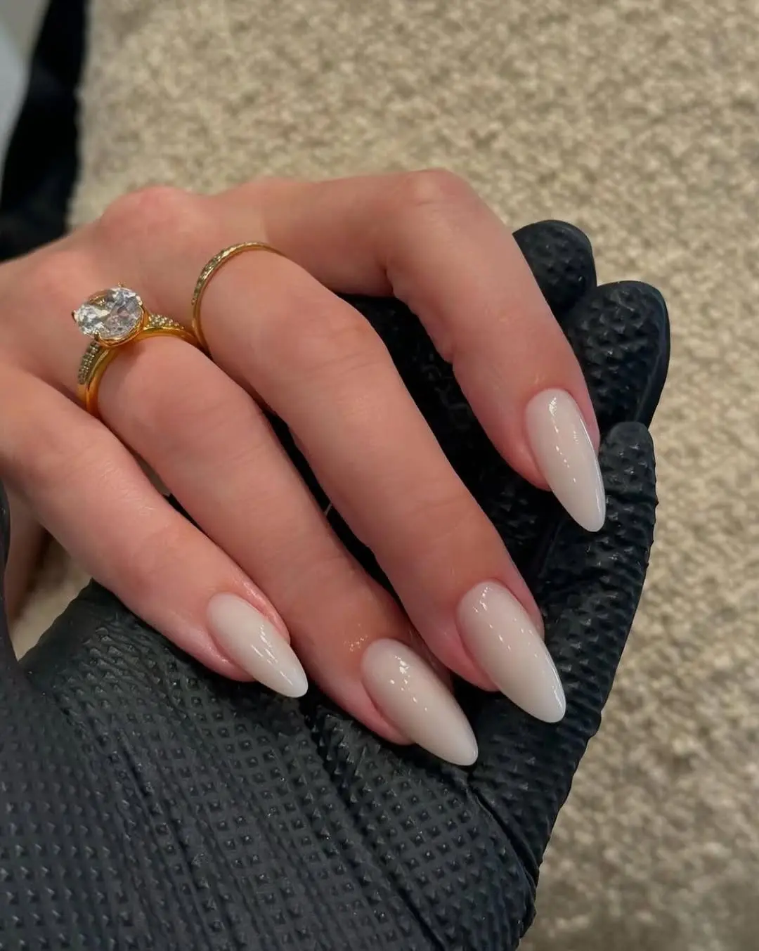 Elegant milky nails with graceful almond shape.