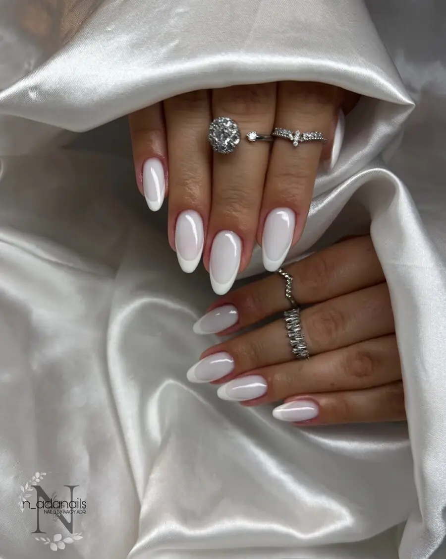 Chic milky nails with elegant jewelry accents