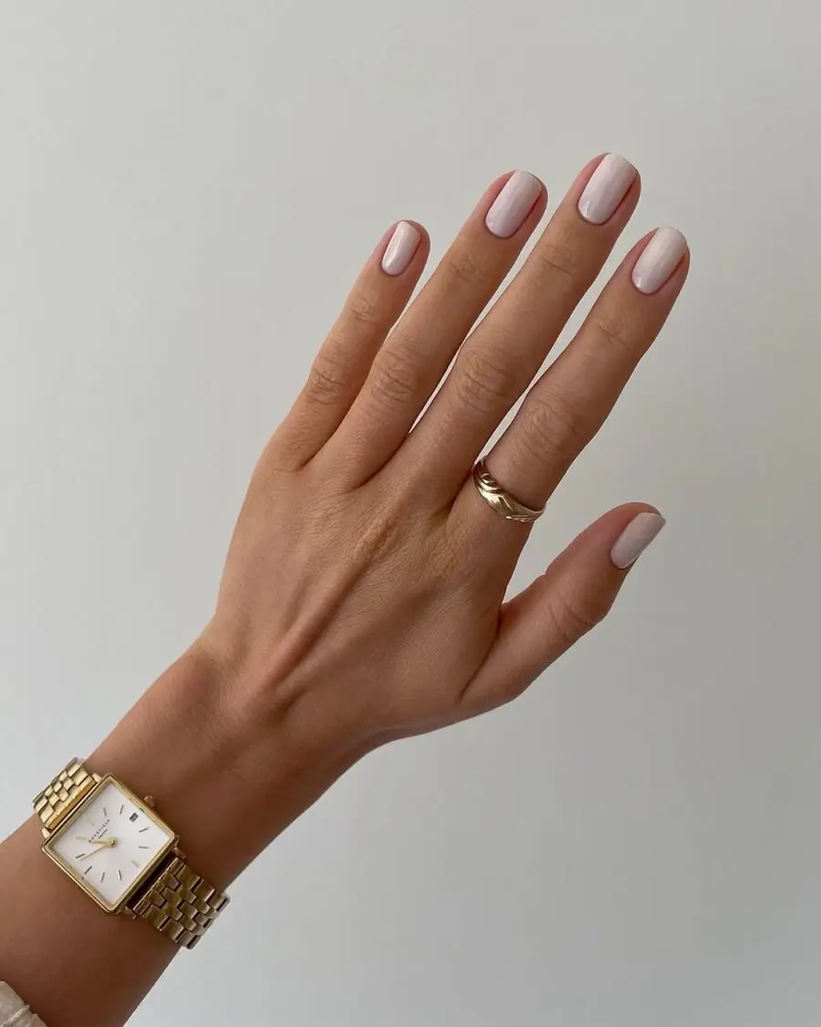 Serene milky nails with elegant watch
