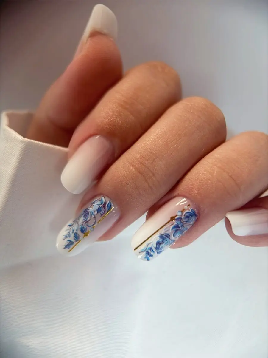 Elegant milky nails with floral art accents