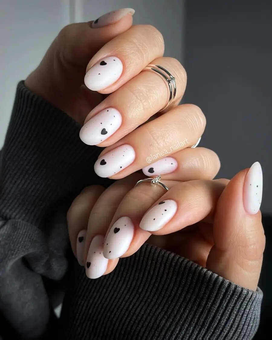 Stylish milky nails with heart designs