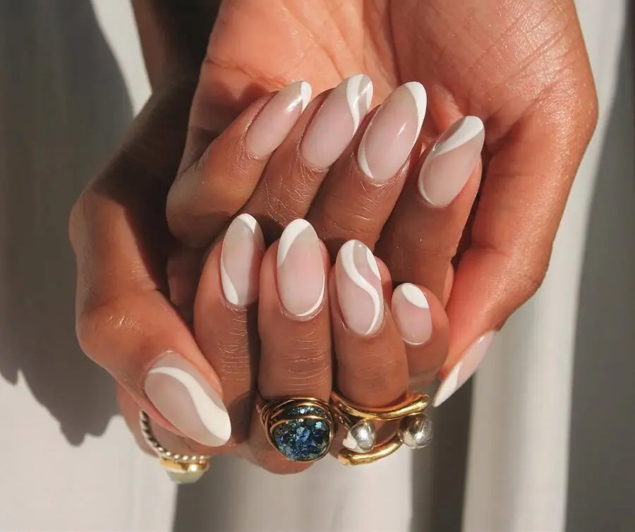 Stylish milky nails with elegant white accents