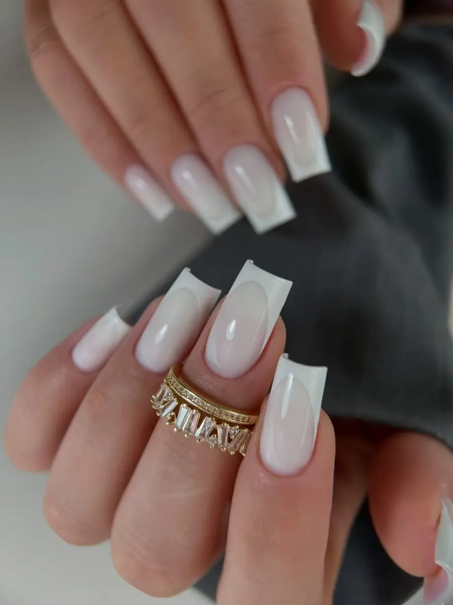 Chic Milky Nails with Dazzling Ring Accent