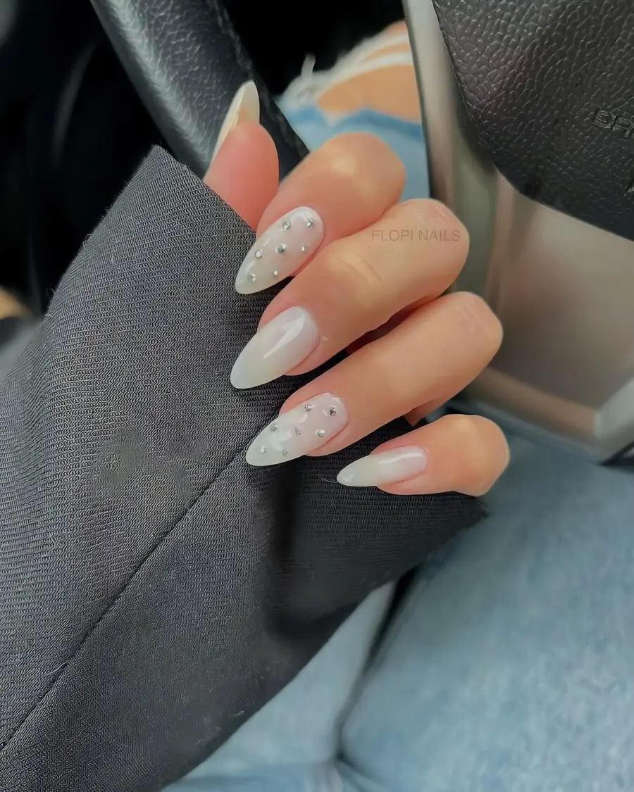 Chic milky nails with elegant studded design