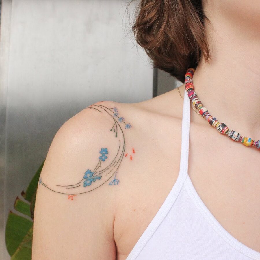 Delicate flower tattoo symbolizes mindfulness and growth