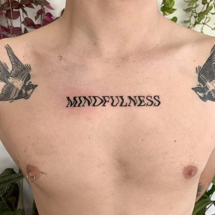 Elegant minimalist mindfulness tattoo on chest