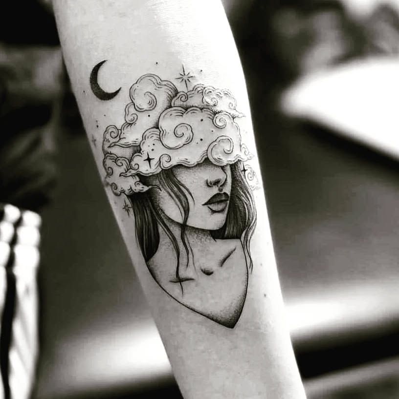 Serene girl with clouds and moon tattoo