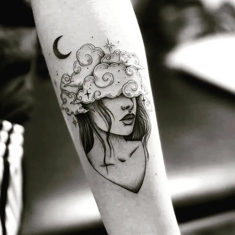 Serene girl with clouds and moon tattoo