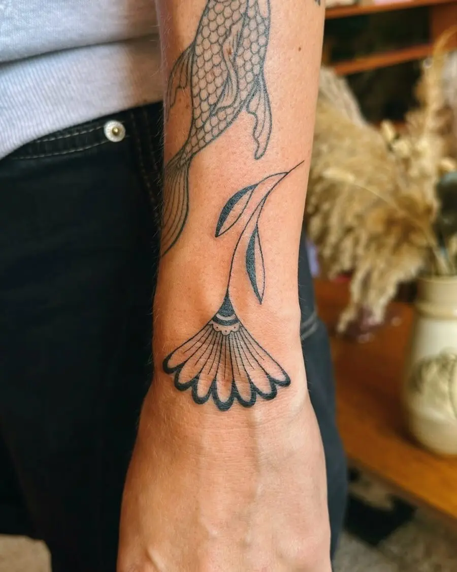 Delicate flower tattoo with mindful symbolism