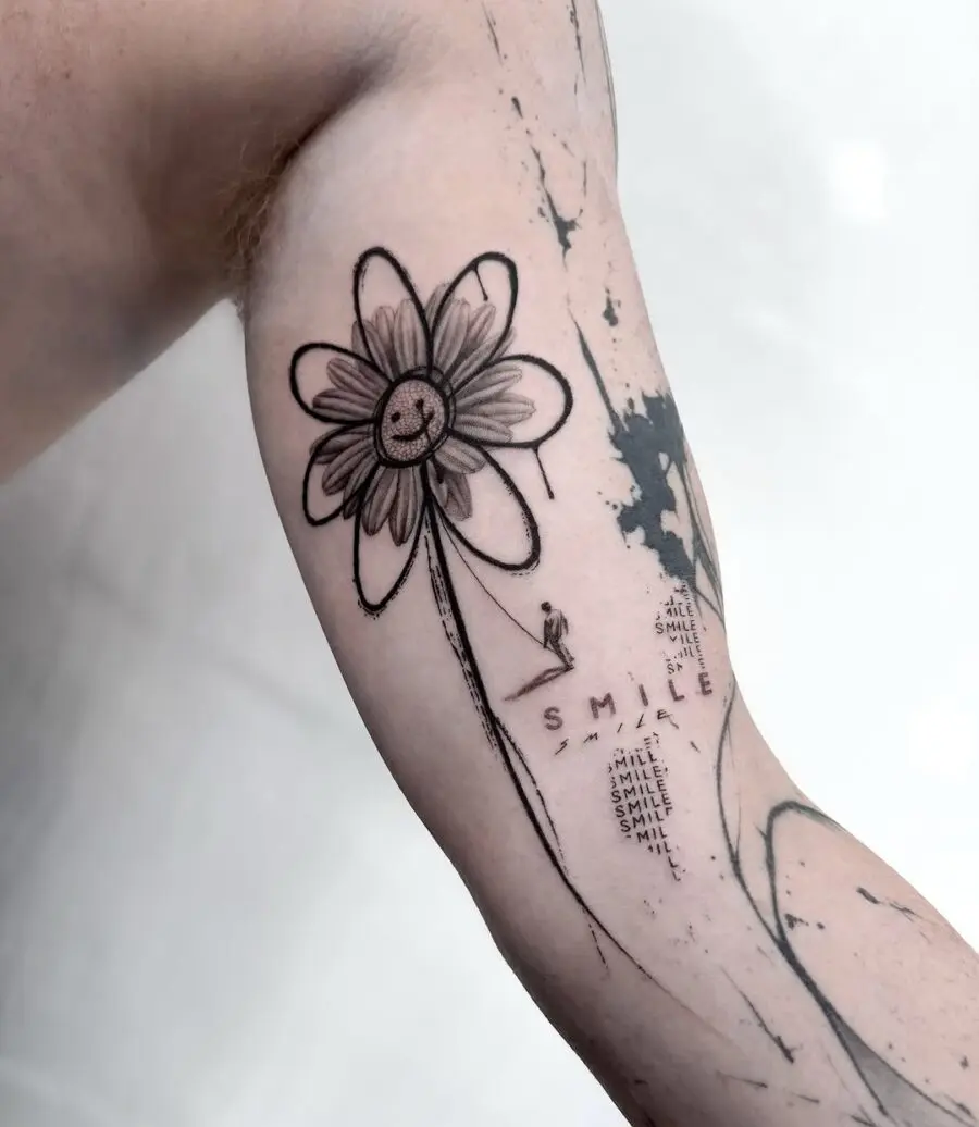 A cheerful flower tattoo with a smile symbol