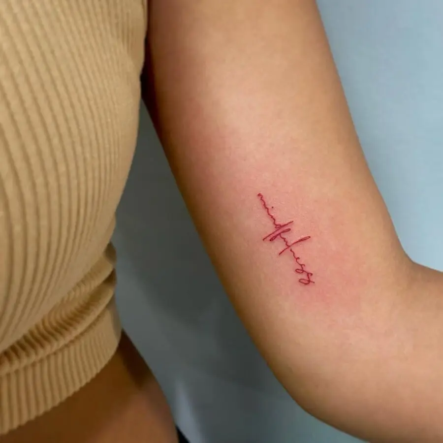 Elegant mindfulness tattoo in minimalist script