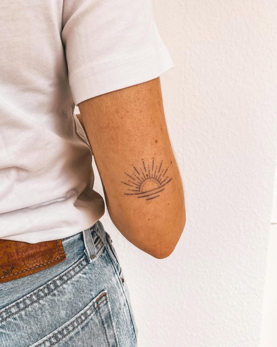 Sunrise tattoo symbolizing positivity and mindfulness