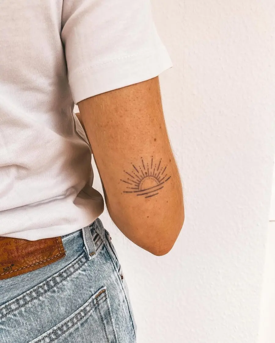 Sunrise tattoo symbolizing positivity and mindfulness