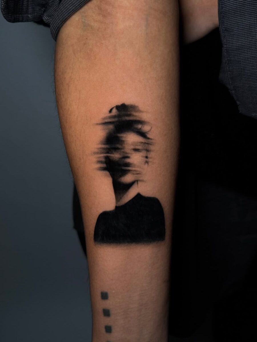Abstract portrait tattoo evokes deep mindfulness