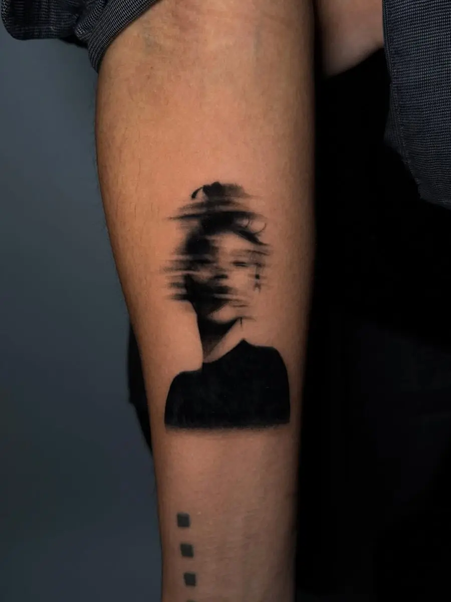 Abstract portrait tattoo evokes deep mindfulness