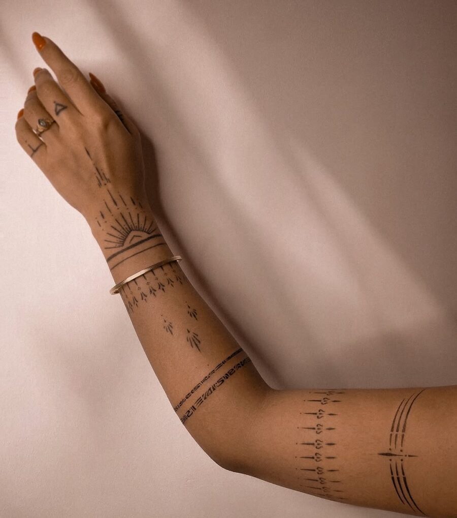 Elegant Mindfulness Tattoos on Arm