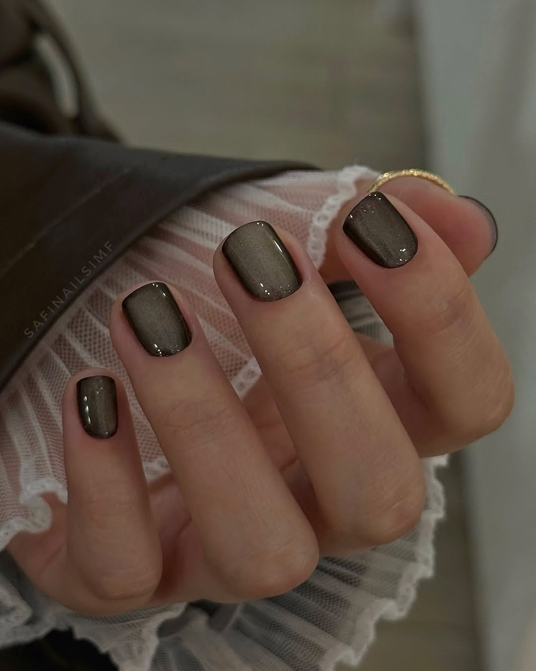 Stylish dark glossy office nails for sophistication