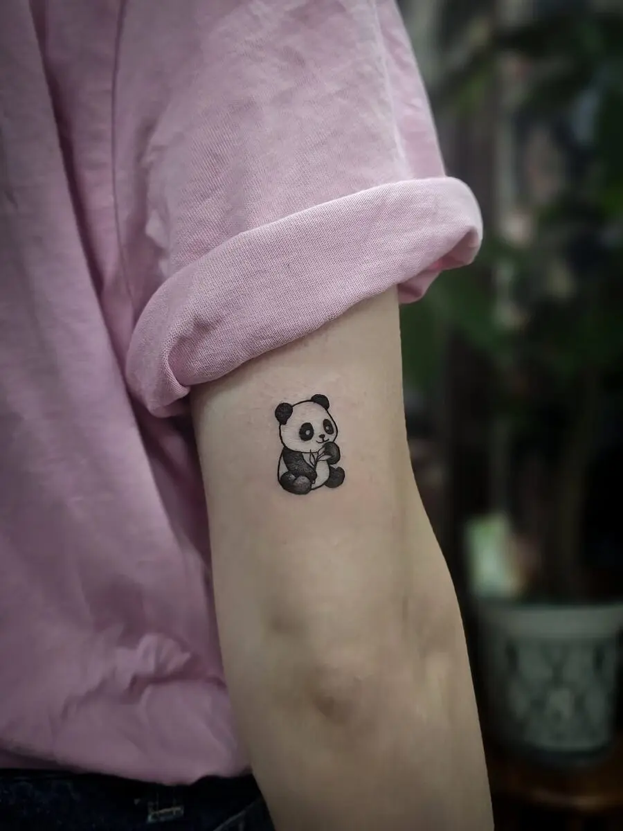 Charming panda tattoo on the arm