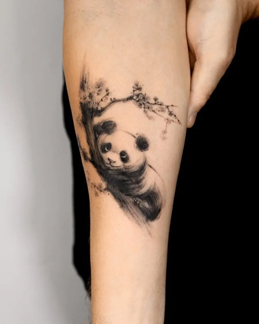 Charming panda tattoo in delicate blackwork style