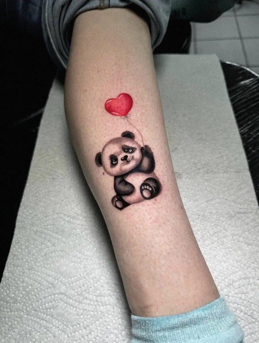 Adorable panda tattoo with a heart balloon