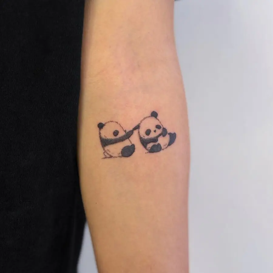 Adorable panda tattoo design on the arm