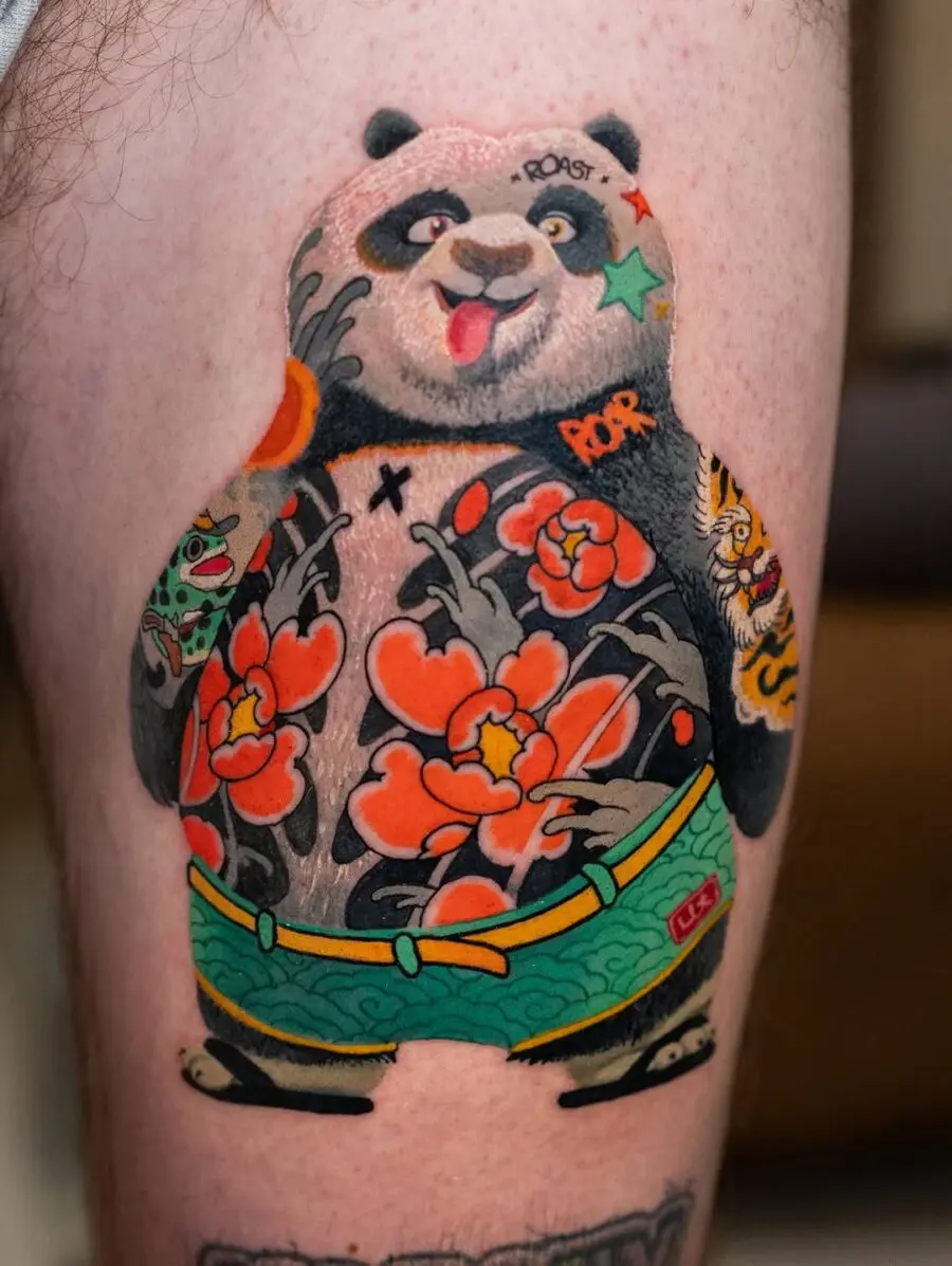 Charming panda tattoo with vibrant floral elements