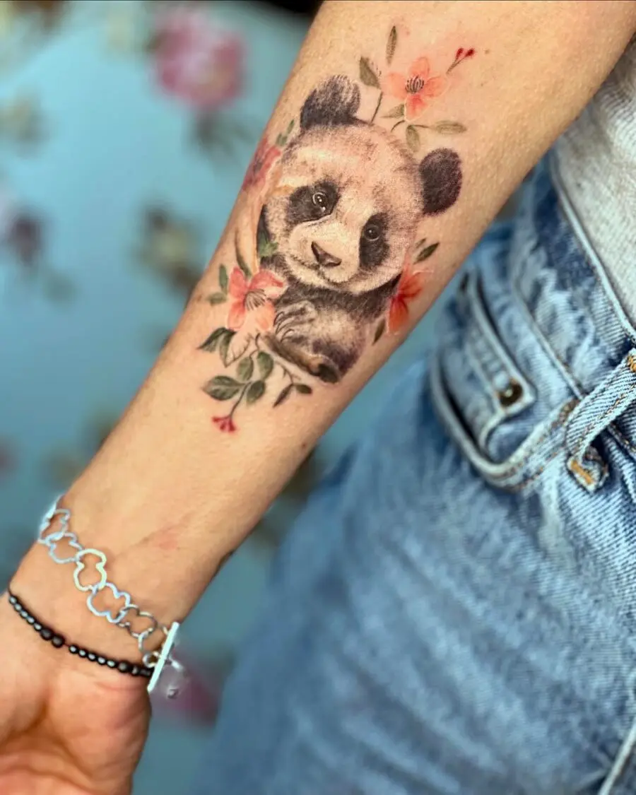 Charming panda tattoo surrounded by blossoms
