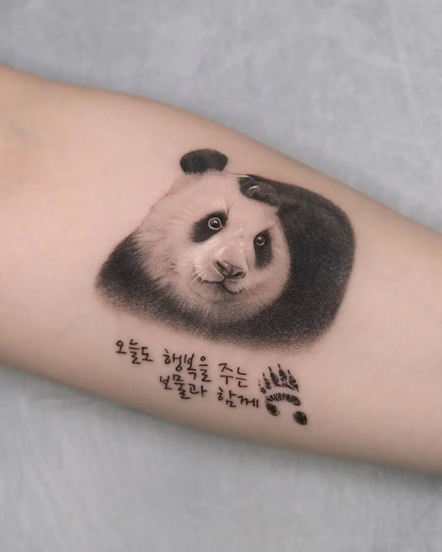Cute panda tattoo with a thoughtful expression