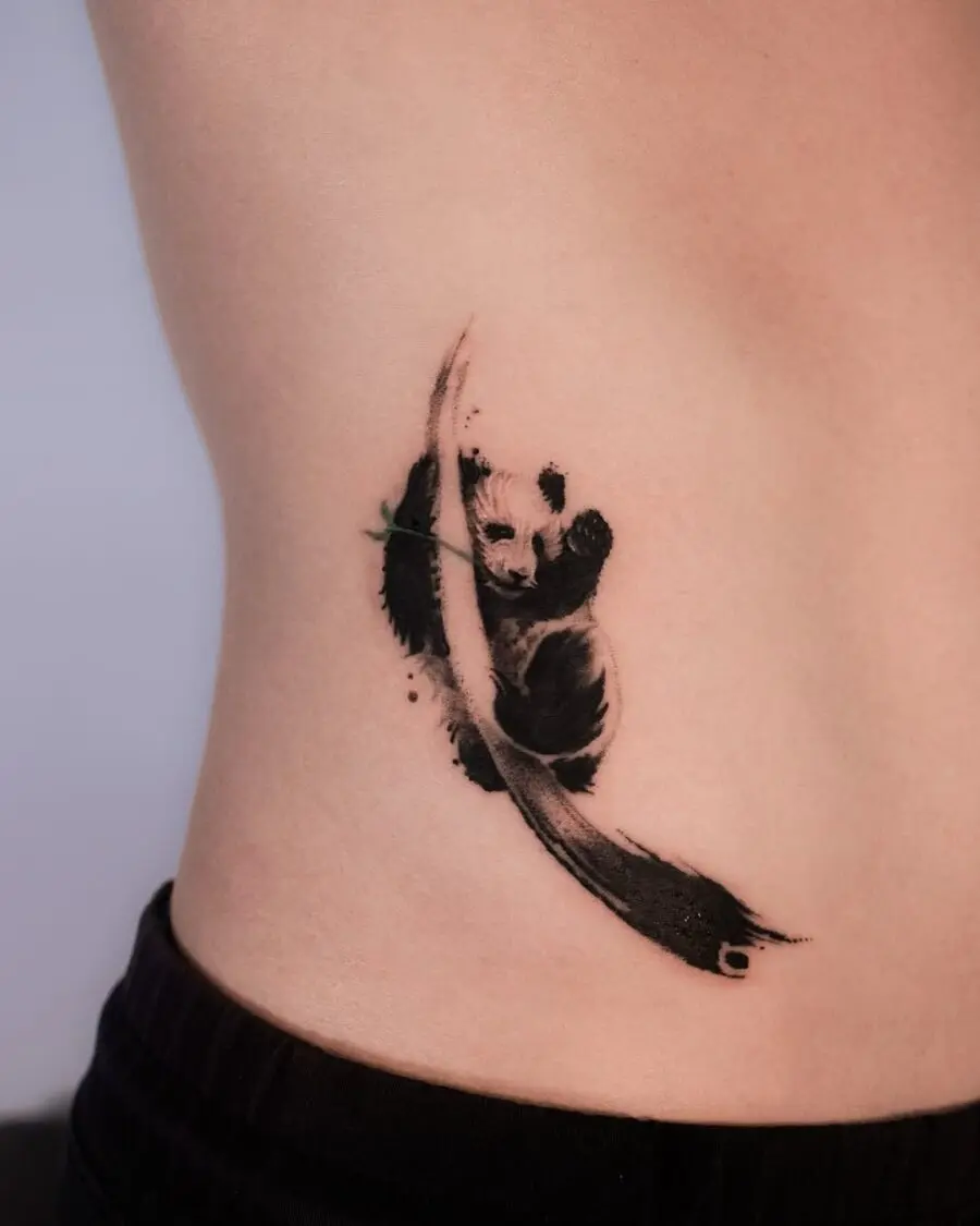 Elegant panda tattoo on the ribcage